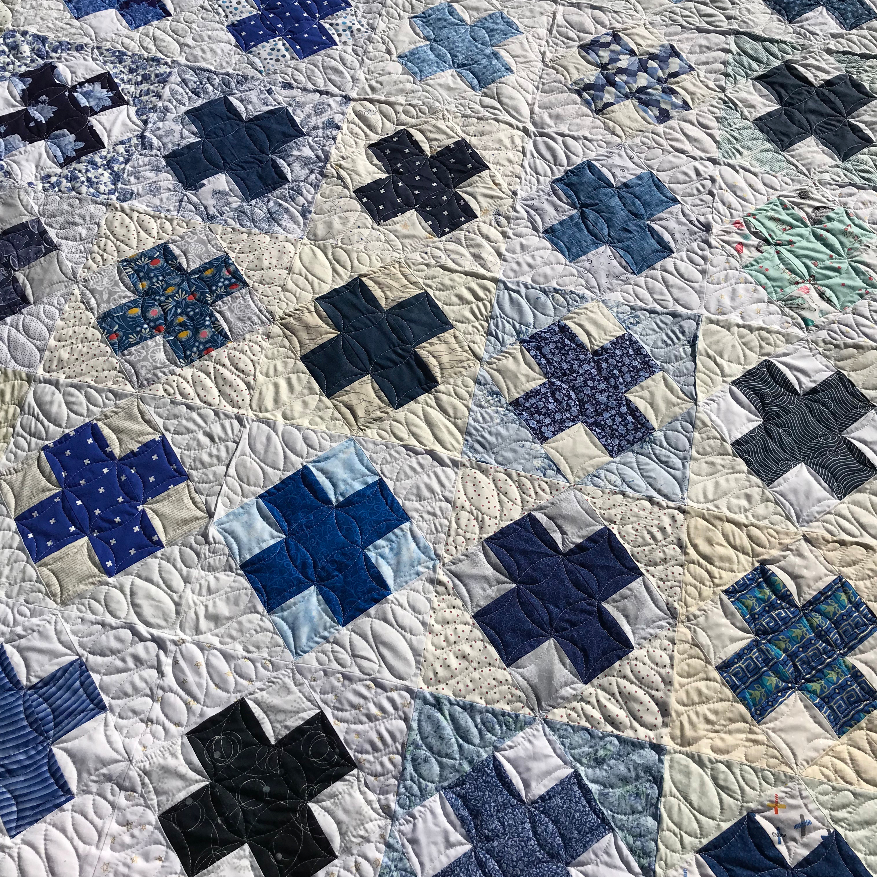 Custom quilting on a Blue Blocks quilt for Crafty Cop charity quilt
